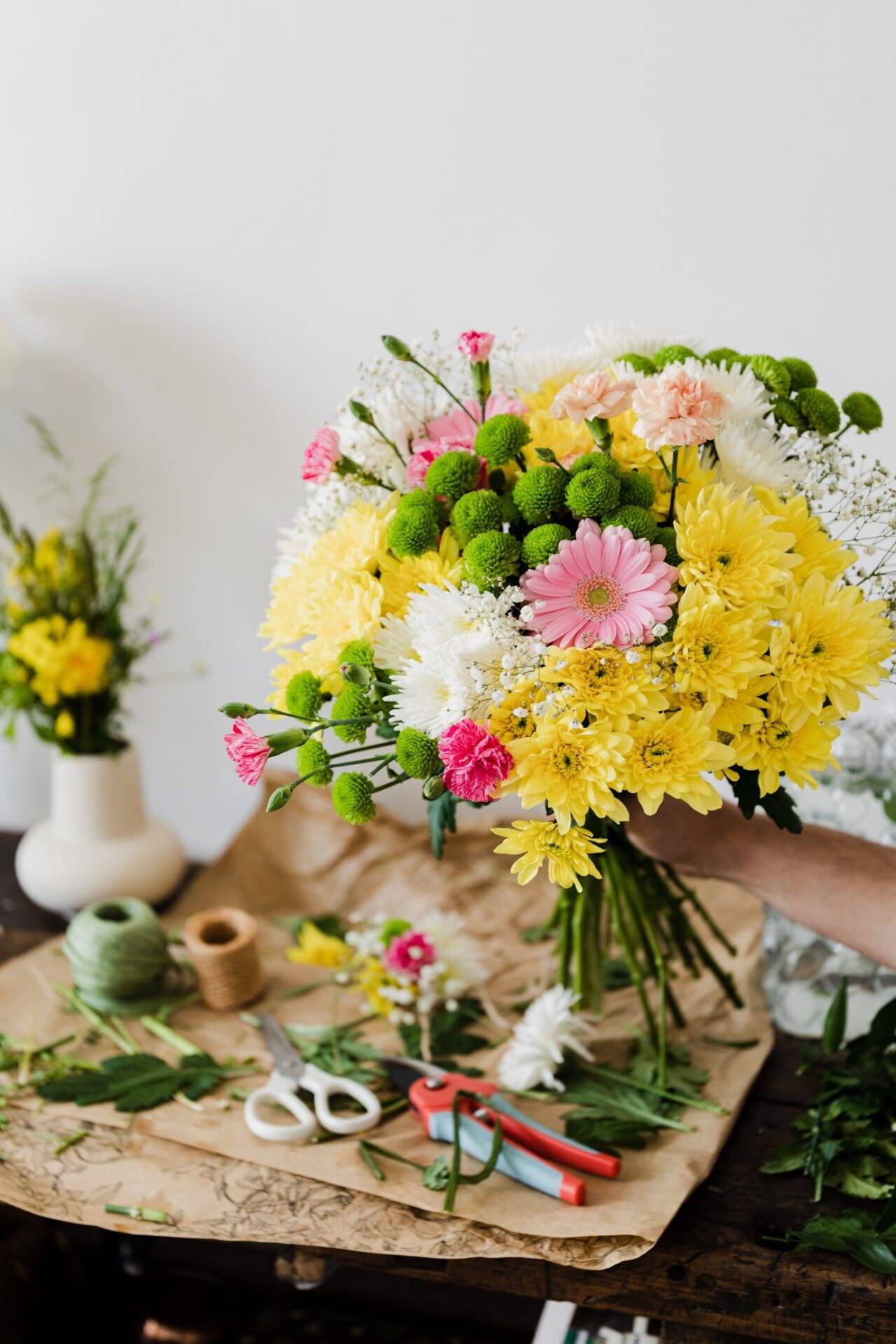 Person Holding White Flower Bouquet<br />
